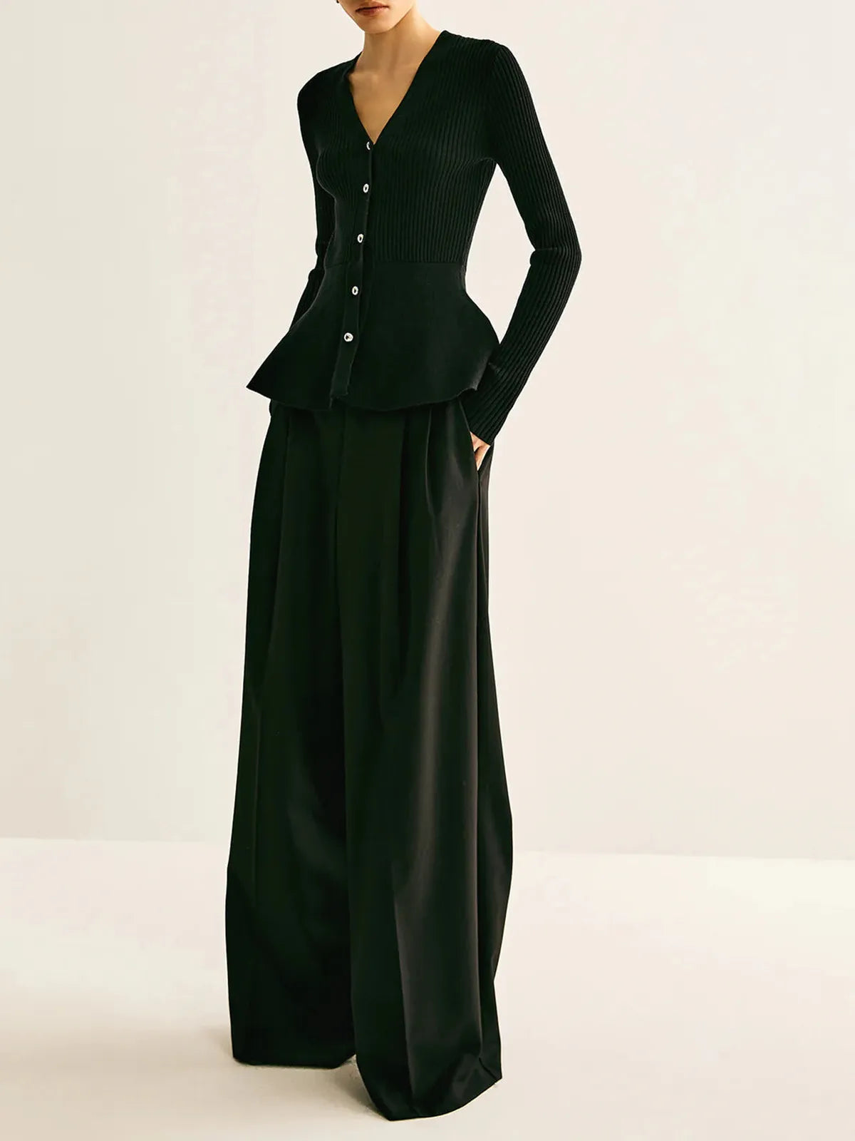Top peplo a coste in maglia con bottoni - Elora Boutique